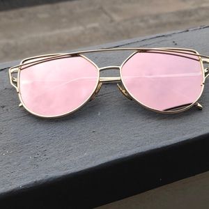 Pink and gold aviator style sunglasses